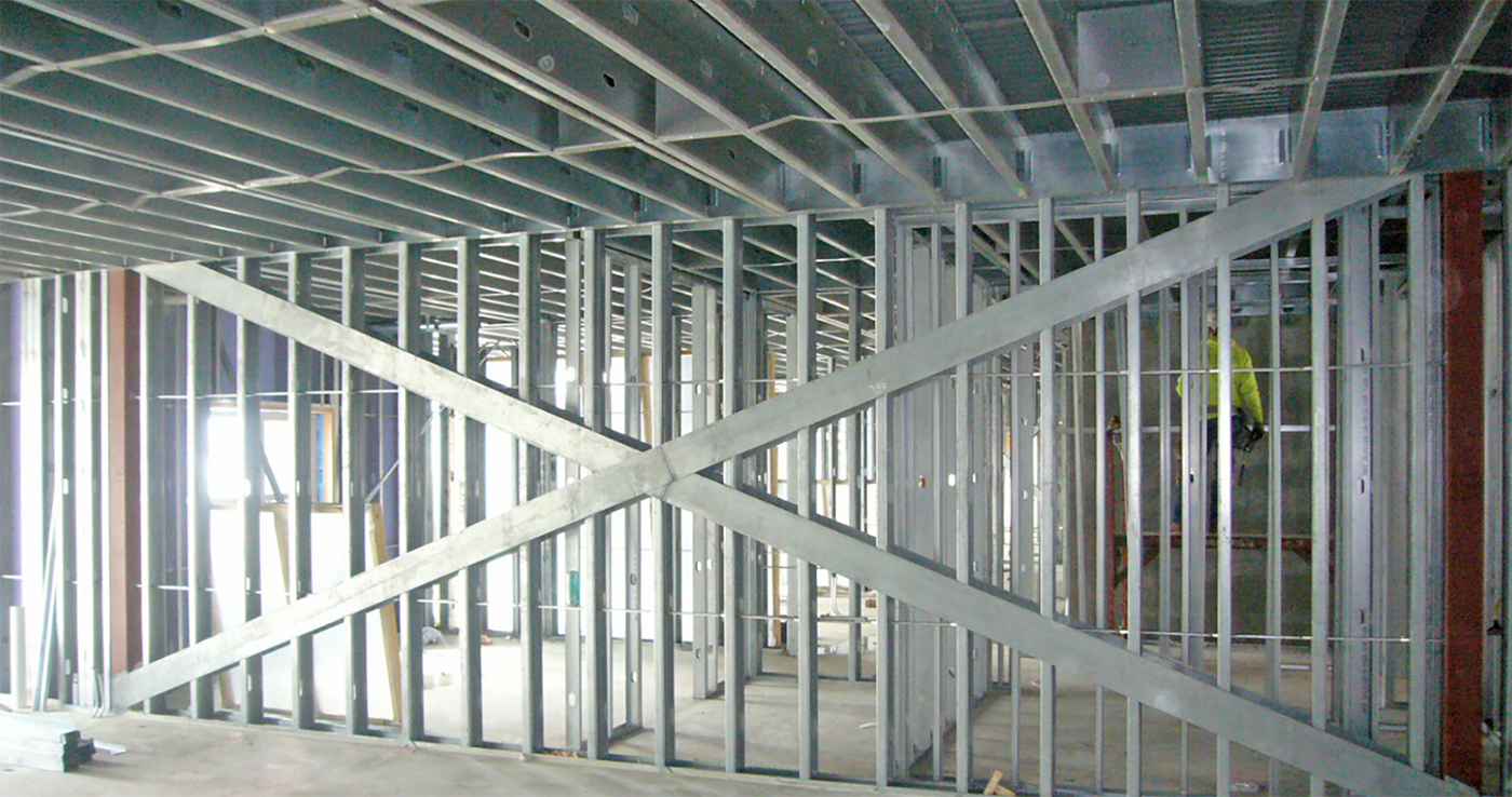 Interior of the Metreau multifamily building showing cold-formed steel stud framing.